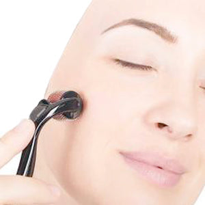 A person demonstrating the gentle application of a derma roller on their skin.
