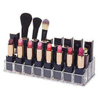 Clear acrylic lipstick holder with 24 sections, showcasing its organized cosmetic storage on a vanity.