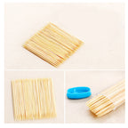Organivo bamboo toothpick dispenser box on a dark background, emphasizing sustainability.