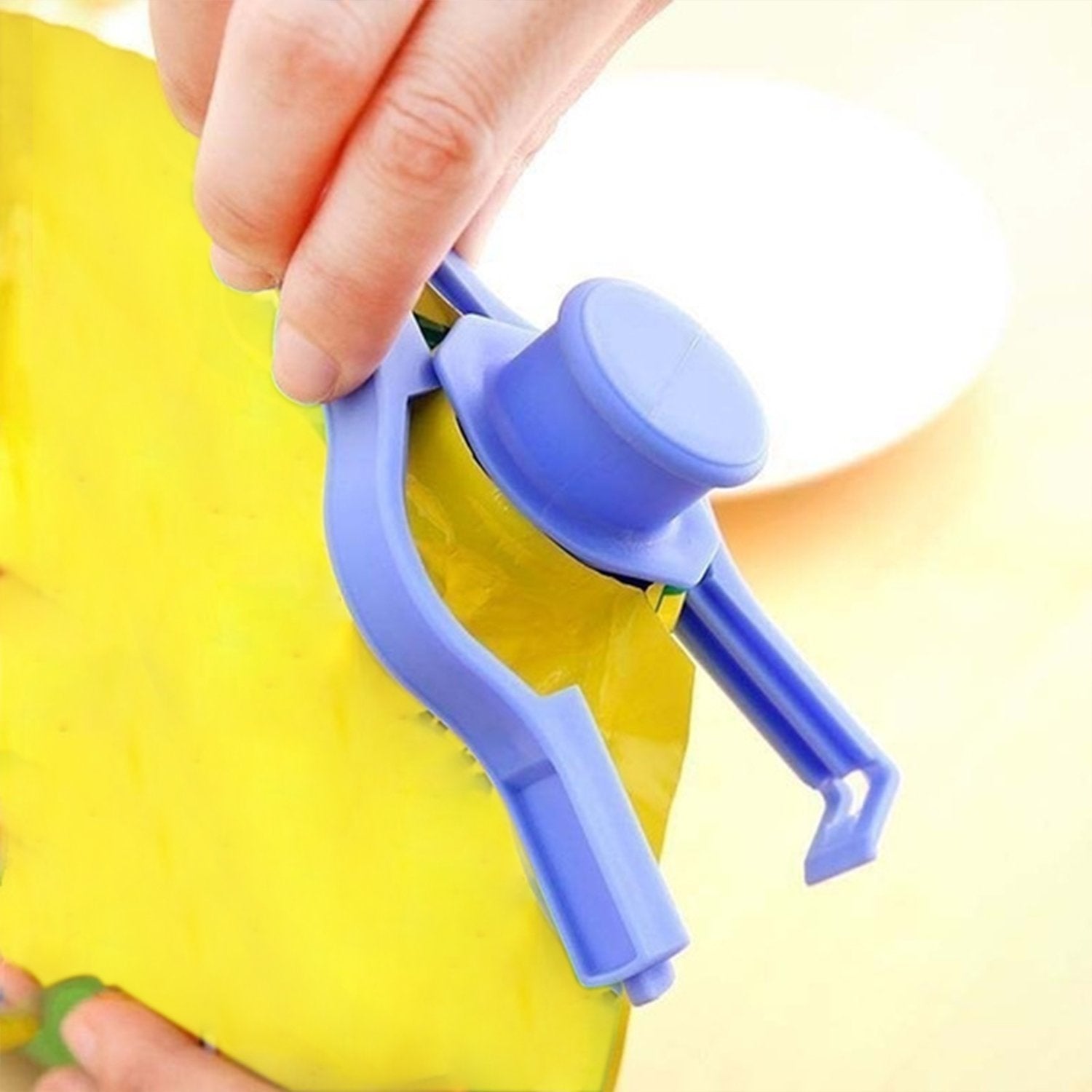 Multiple food bag clips in various colours on kitchen counter.