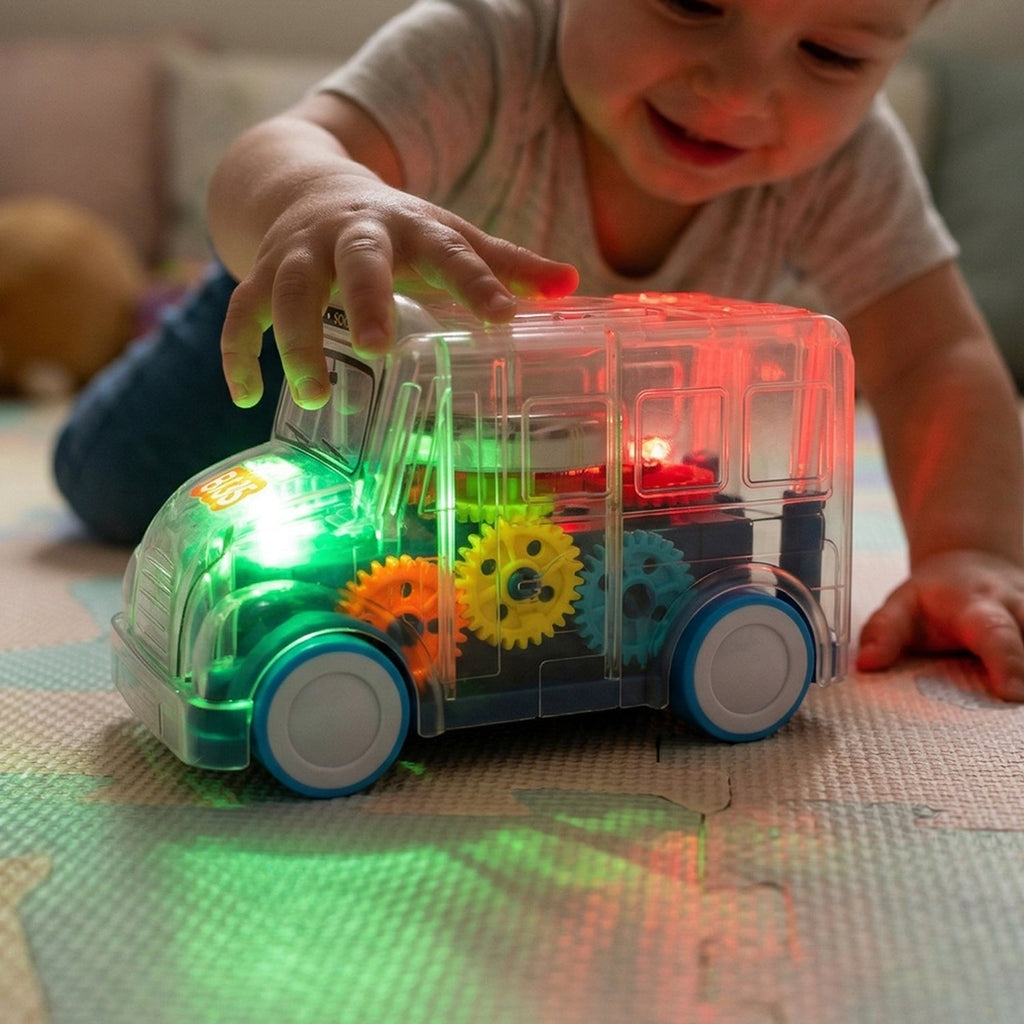 Transparent school bus toy with moving lights and music