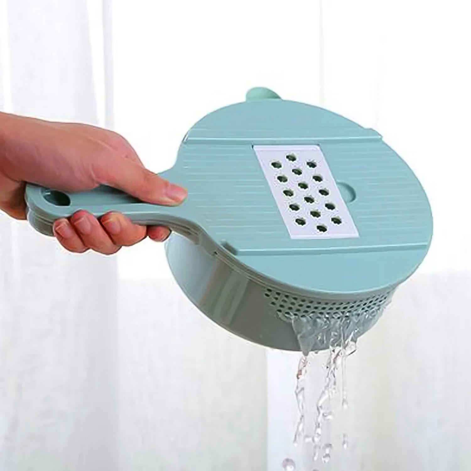 Manual vegetable chopper with multiple blades in kitchen