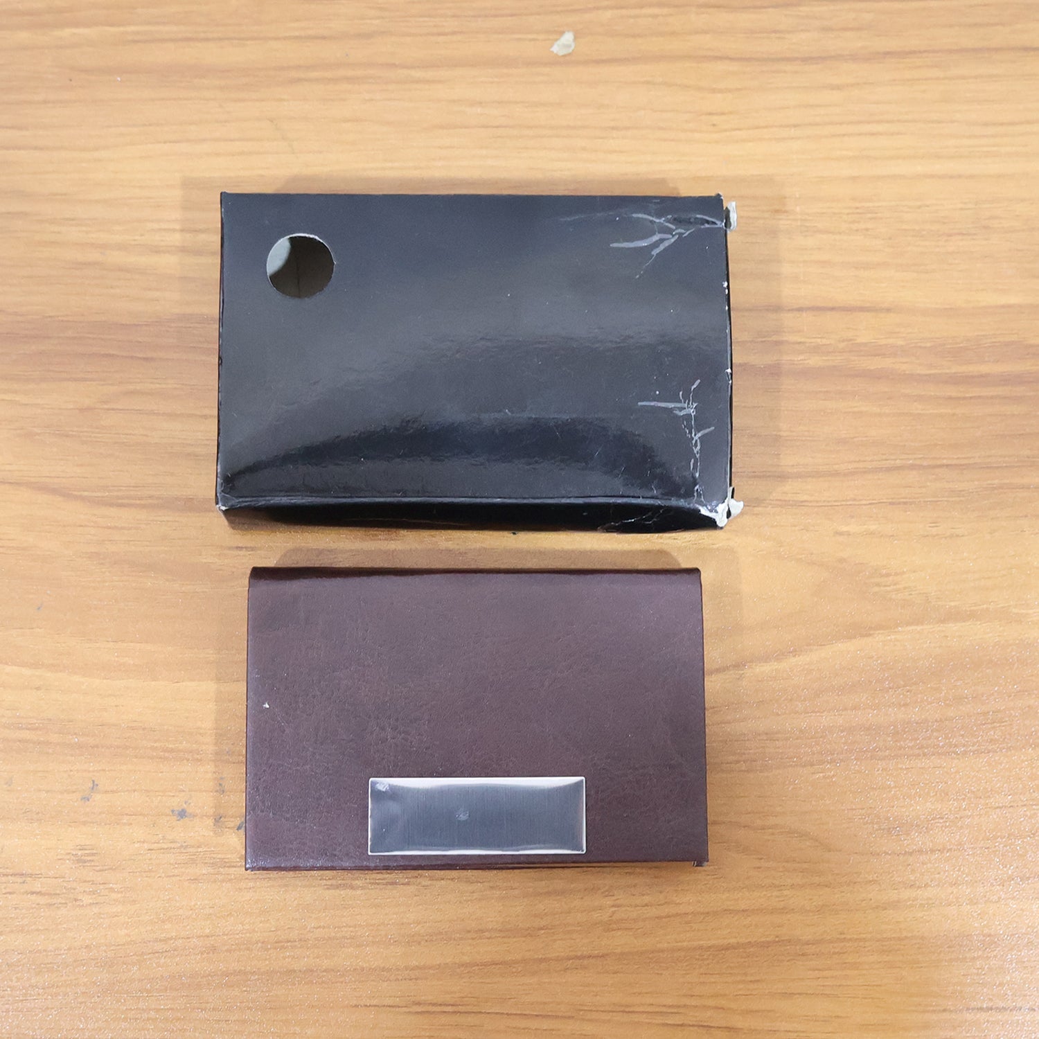 Top view of business card case highlighting sleek metal detailing