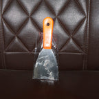 Putty knife with a comfortable soft rubber handle and a hanging hole for easy storage.