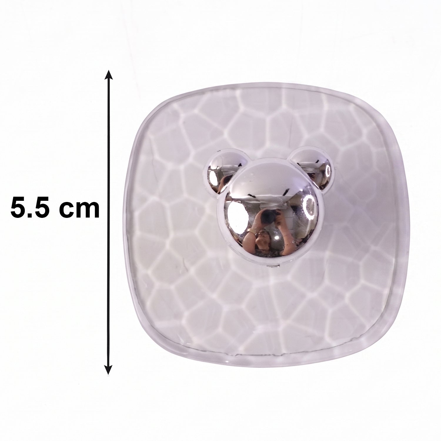Side view showing clear adhesive wall hook mounted seamlessly on a wall.