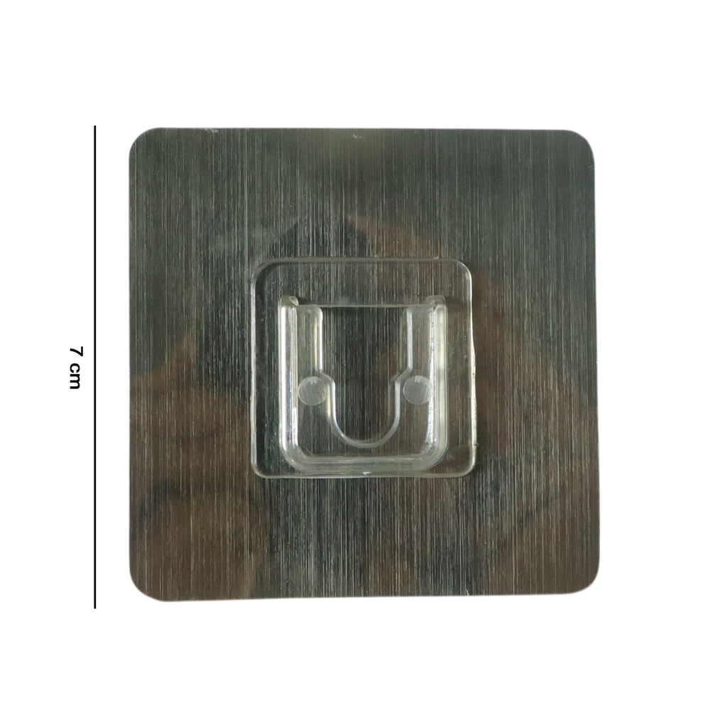 Adhesive wall hanger hook on smooth surface shown in use