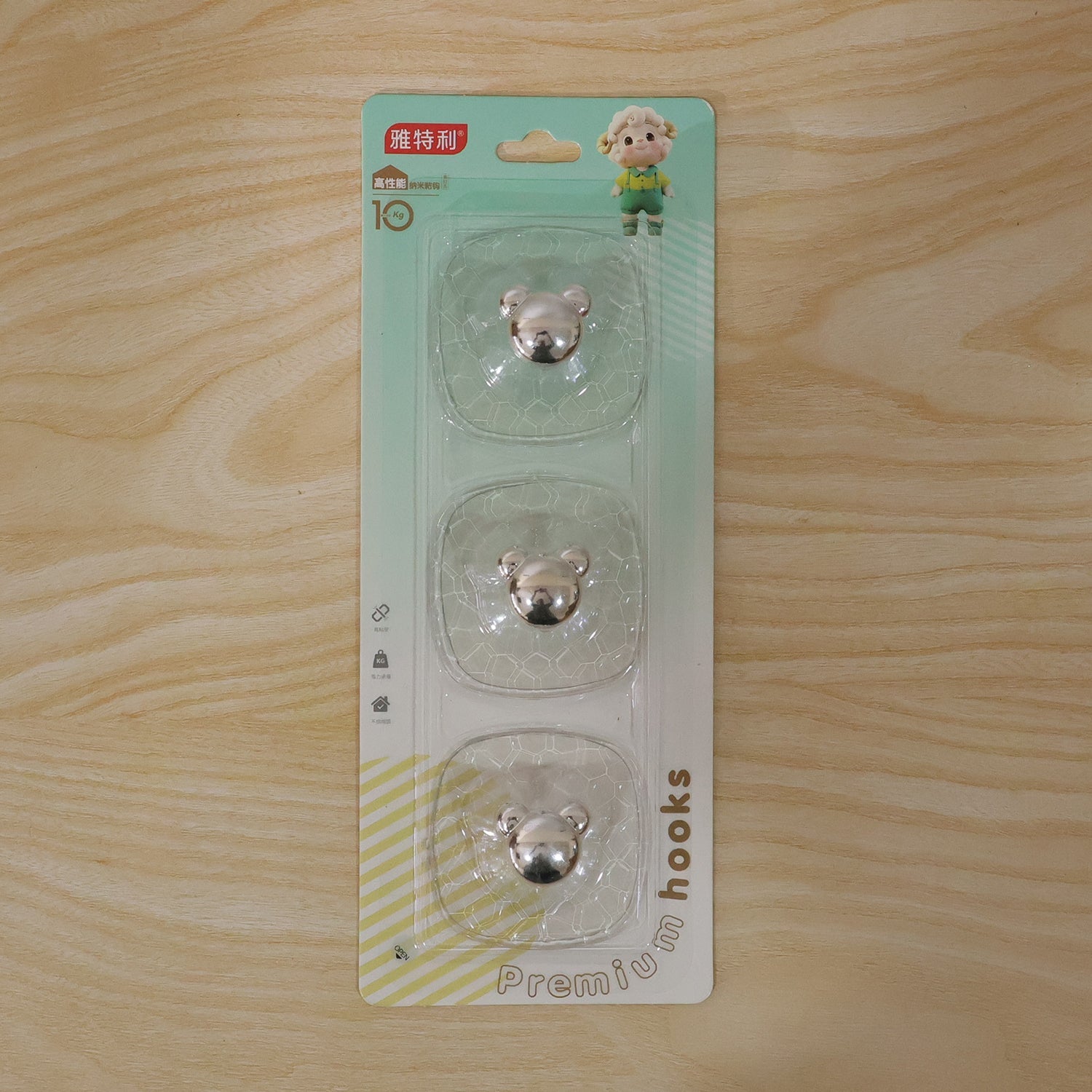 Transparent adhesive wall hook with strong grip ideal for home organization.