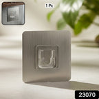 Strong adhesive wall hook attached to smooth surface for hanging items