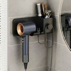 Dryer rack mounted on bathroom wall holding hair styling tools