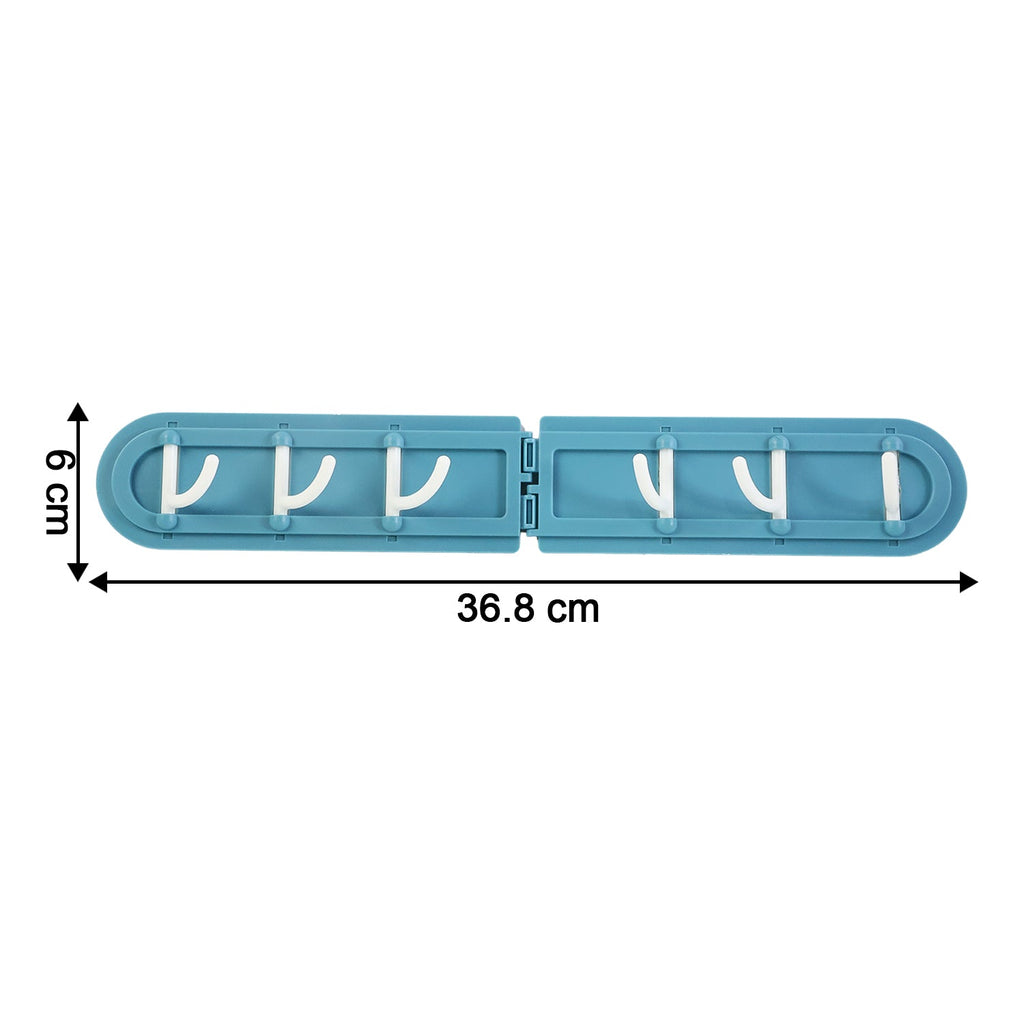 Space-saving adhesive foldable hook rack folded flat against wall