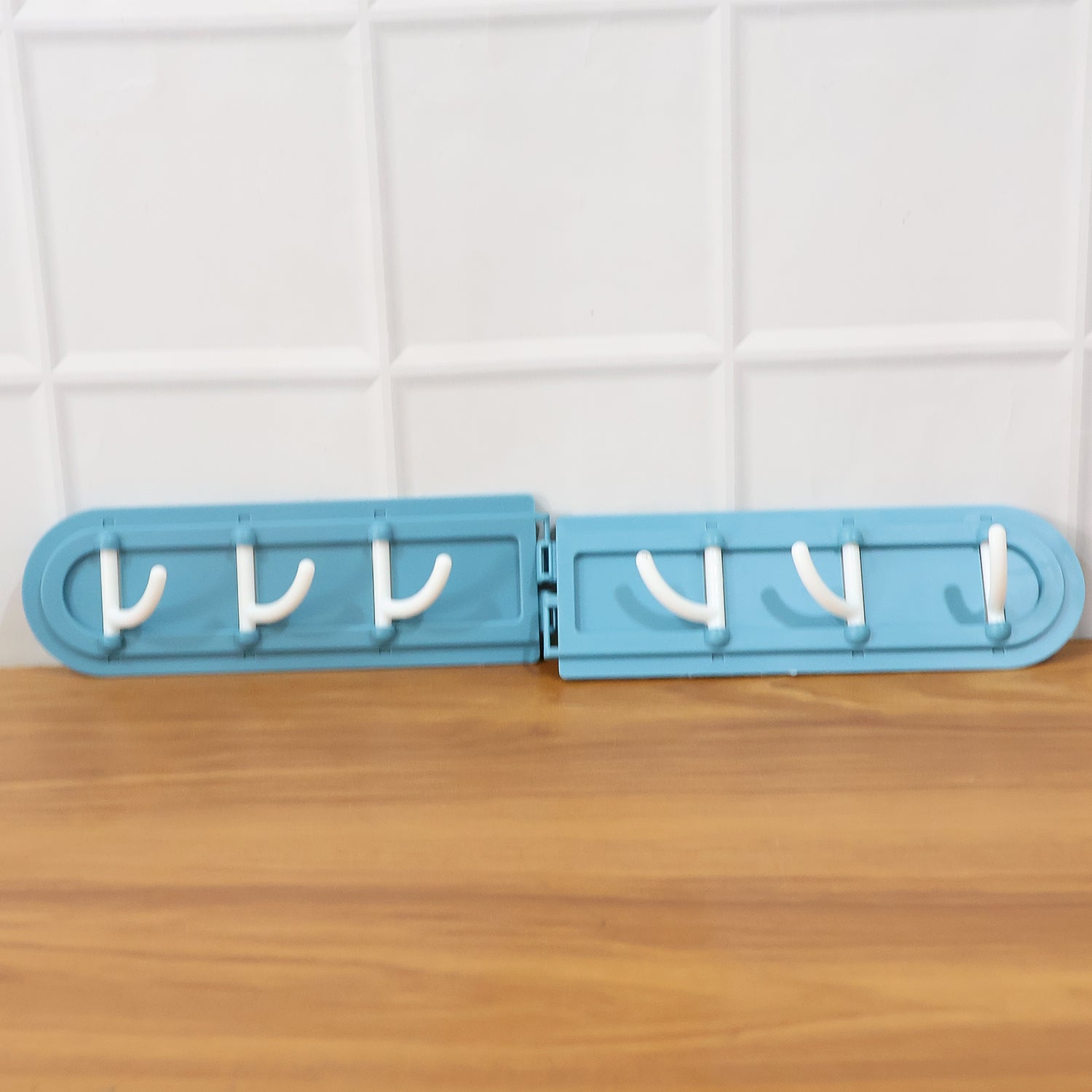 Foldable rotating hook rack demonstrating 180-degree rotational movement