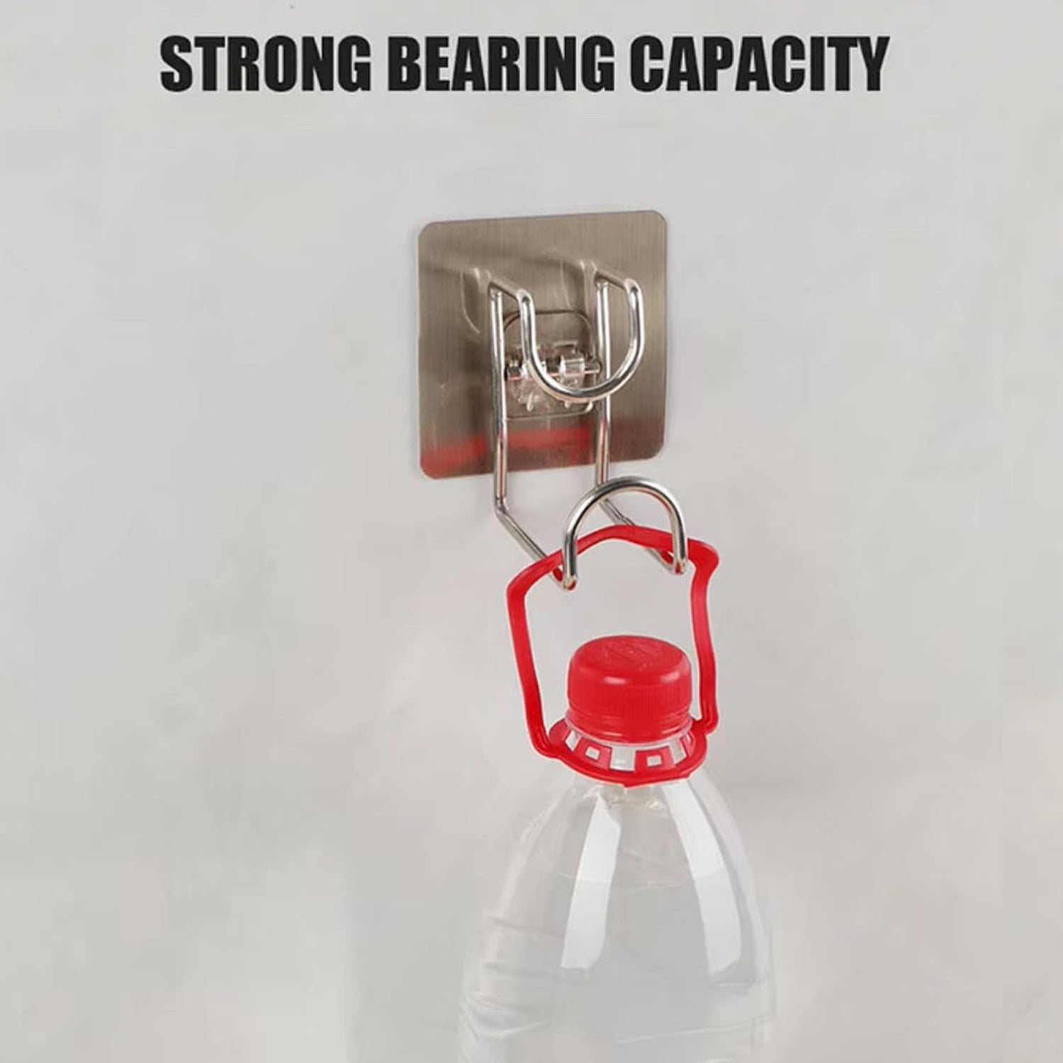 Kitchen towel neatly hung on a transparent adhesive wall hook for easy access.