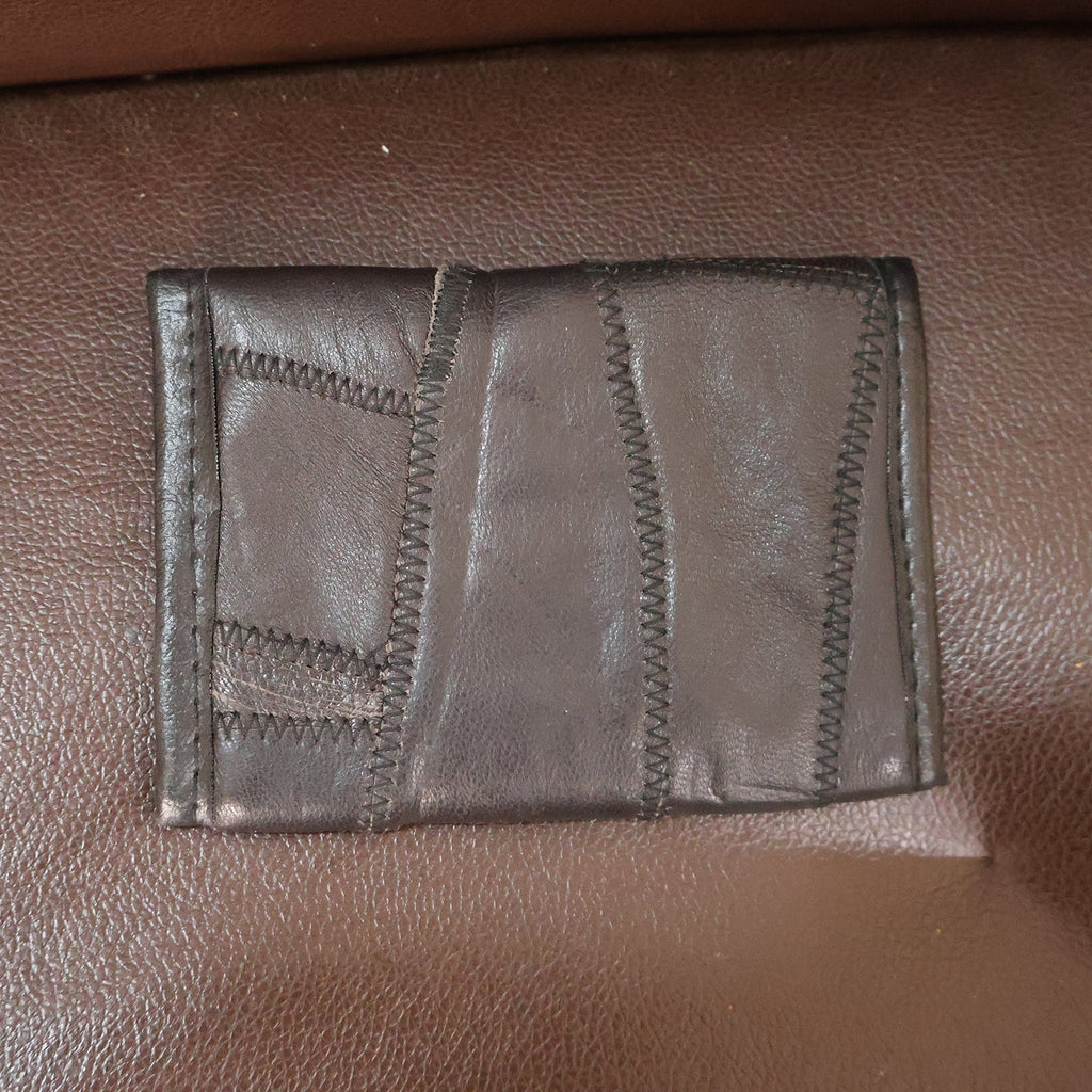 Texture detail of genuine leather on slim bi-fold wallet surface