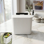 Front view of portable plastic dustbin with lid