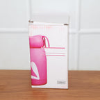 Reusable glass water bottle with playful bunny print design