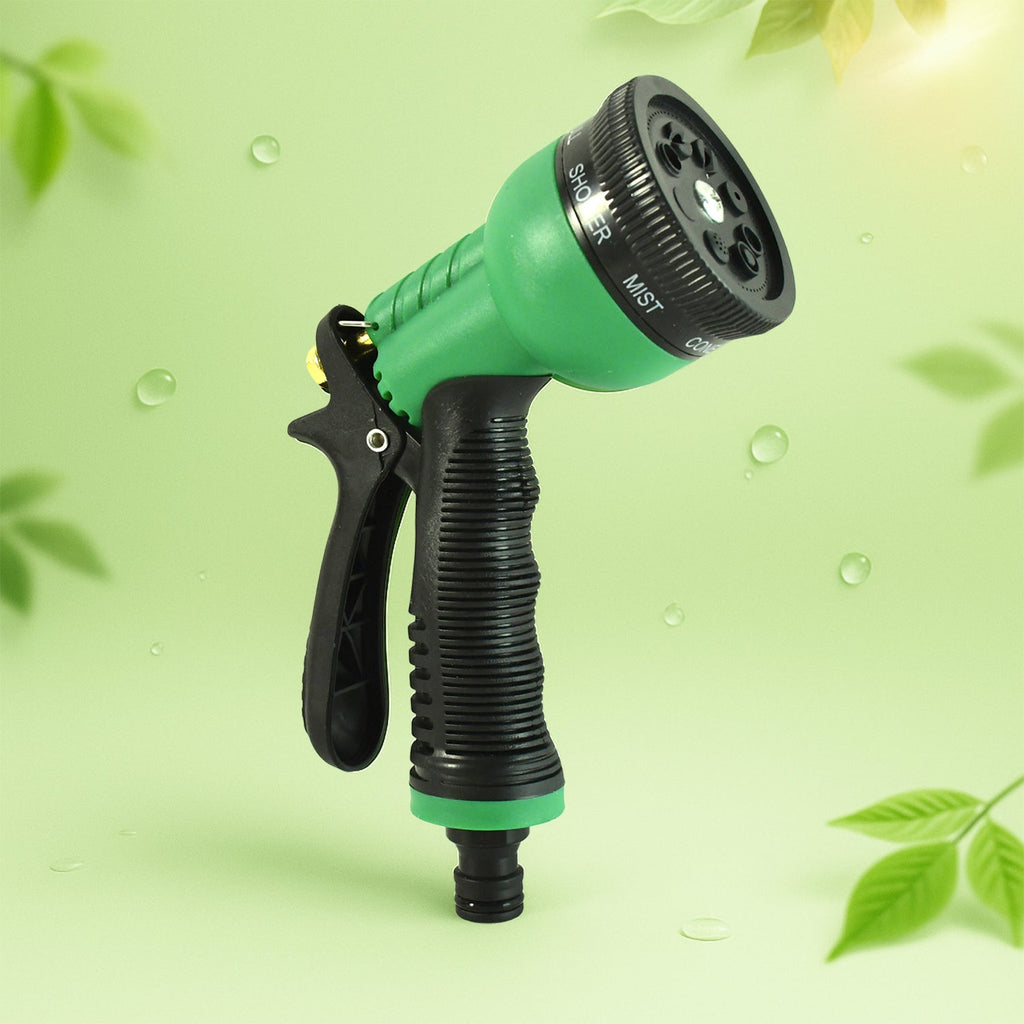 Garden hose spray nozzle laid out showcasing spray patterns dial