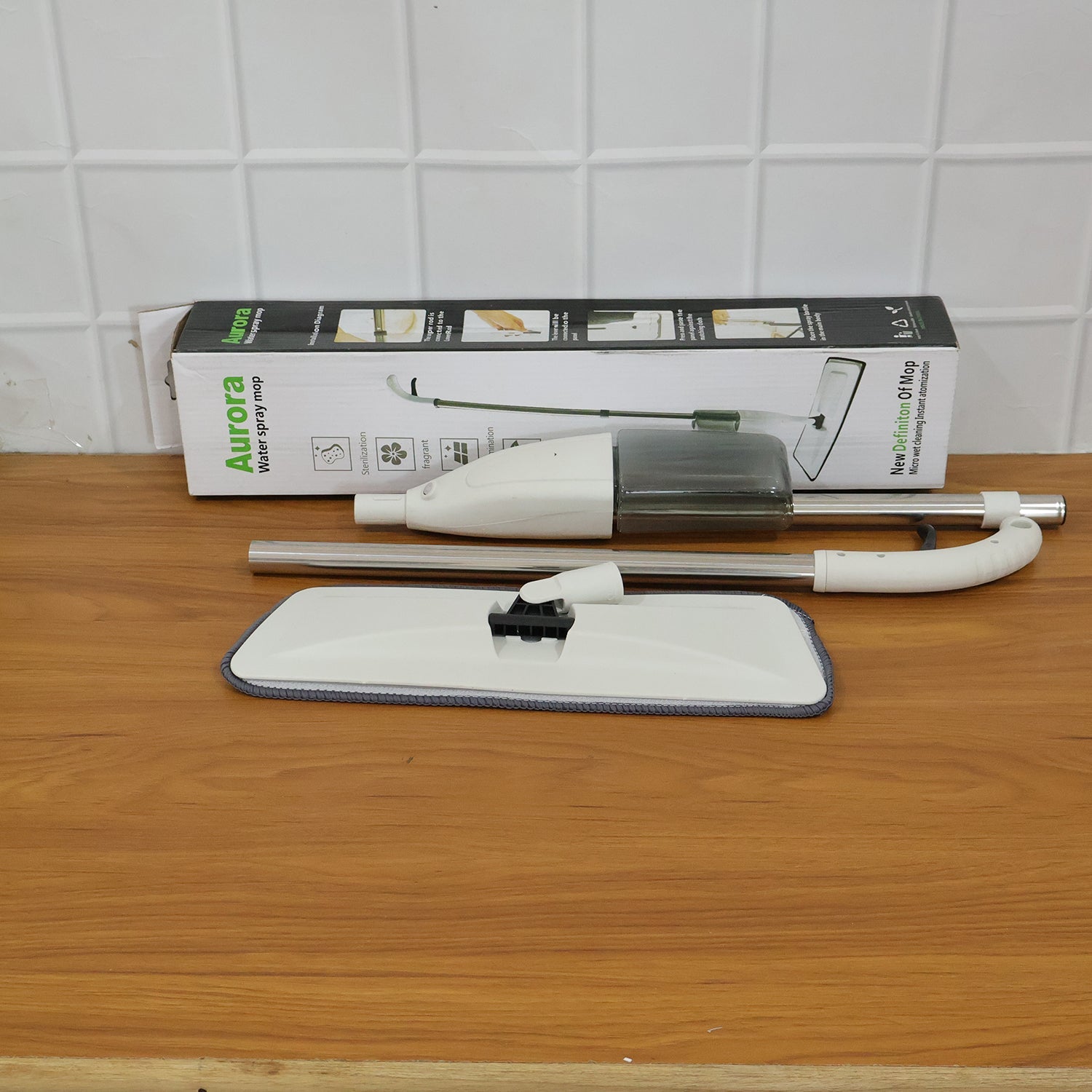 Cleaning spray mop with microfiber pad for quick touch-ups and regular use