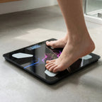 Back view of the digital weighing scale, showing its battery compartment and anti-slip feet.