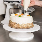 A Cake Decorating Nozzle Set box with various metal tips and plastic piping bags.