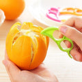 A Snail Orange Peeler with its unique ring design, ready to use for effortless citrus peeling.