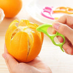 A Snail Orange Peeler with its unique ring design, ready to use for effortless citrus peeling.