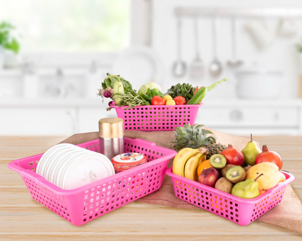 Set of three Plastic Cane Fruit Baskets in large, medium, and small sizes on a kitchen counter.