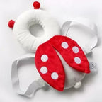 A baby in a bee-shaped head protector actively crawling on the floor, showcasing crawling safety gear.