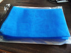 Assorted colourful vegetable fridge storage bags for kitchen organisation.