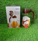 Ganesh 1000ml stainless steel oil dispenser on a kitchen counter.
