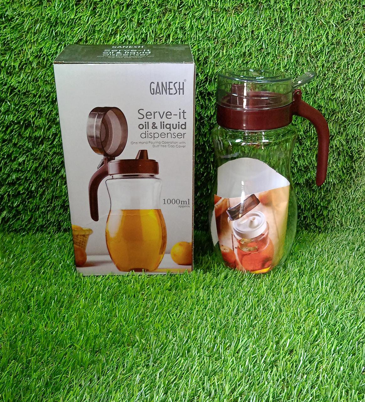 Ganesh 1000ml stainless steel oil dispenser on a kitchen counter.