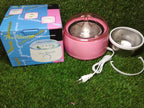 Packaging of the AuriGlam automatic heater for wax and oil.