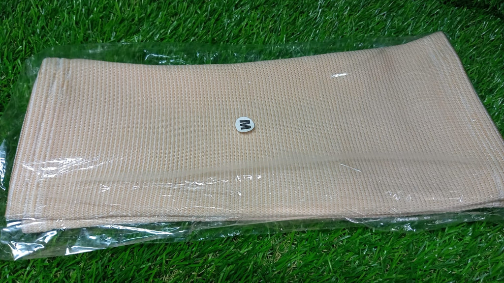 Person wearing a medium knee support cap under clothing for discreet support.