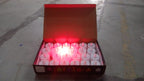 Red LED flameless tealight candles glowing warmly indoors for festive décor