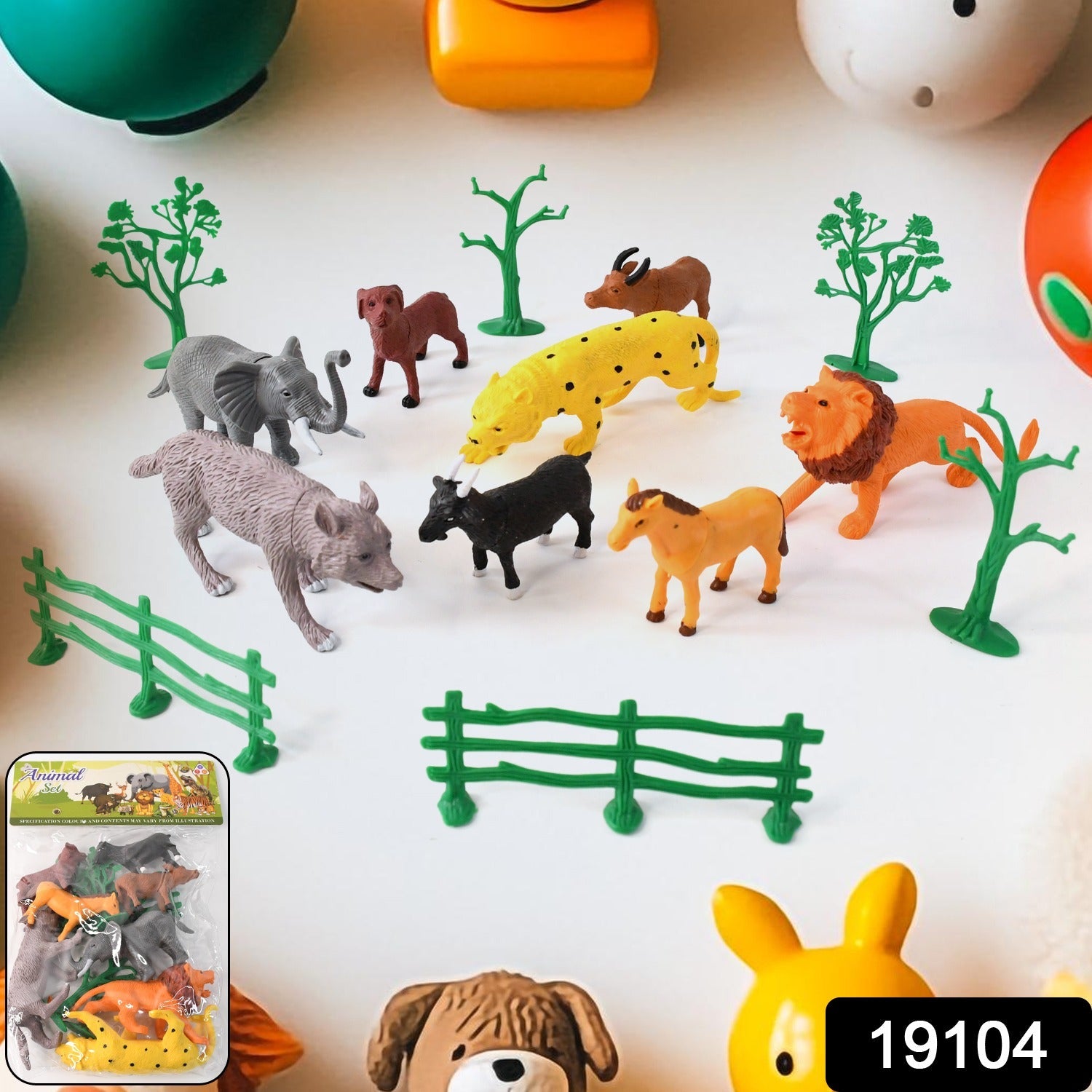 Close-up of realistic lion and elephant plastic figurines from Animal Kingdom toy set