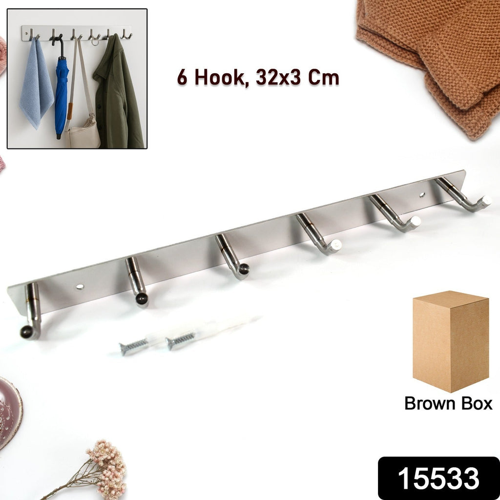 Wall-mounted 6-hook stainless steel coat rack holding bags and coats