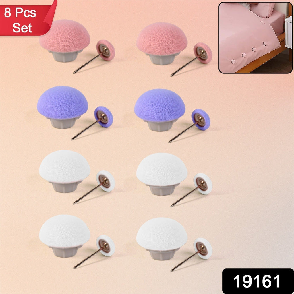 Close-up of mushroom upholstery pins securing sofa fabric