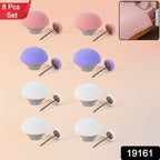 Close-up of mushroom upholstery pins securing sofa fabric