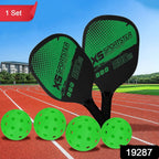 Close-up image of lightweight pickleball paddles and plastic perforated balls for outdoor play