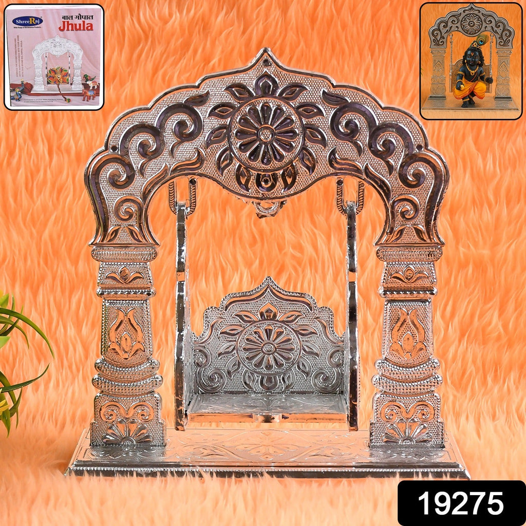 Ornamental silver-coated Krishna Jhula swing displayed in home mandir