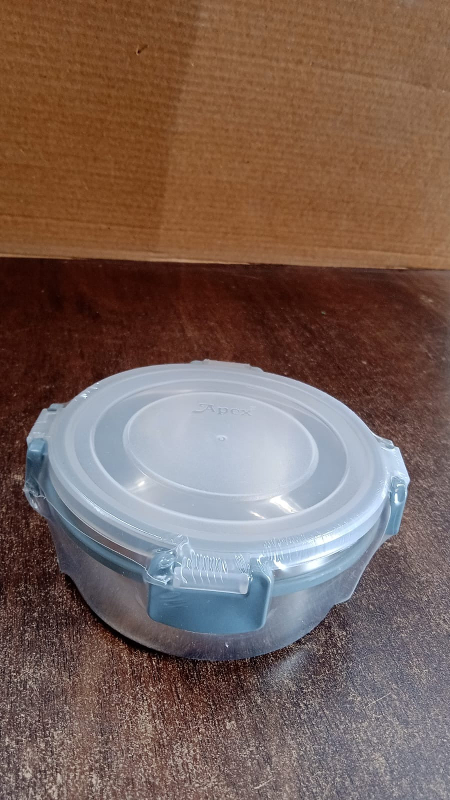 Compact 500 ml airtight food storage container held in hand