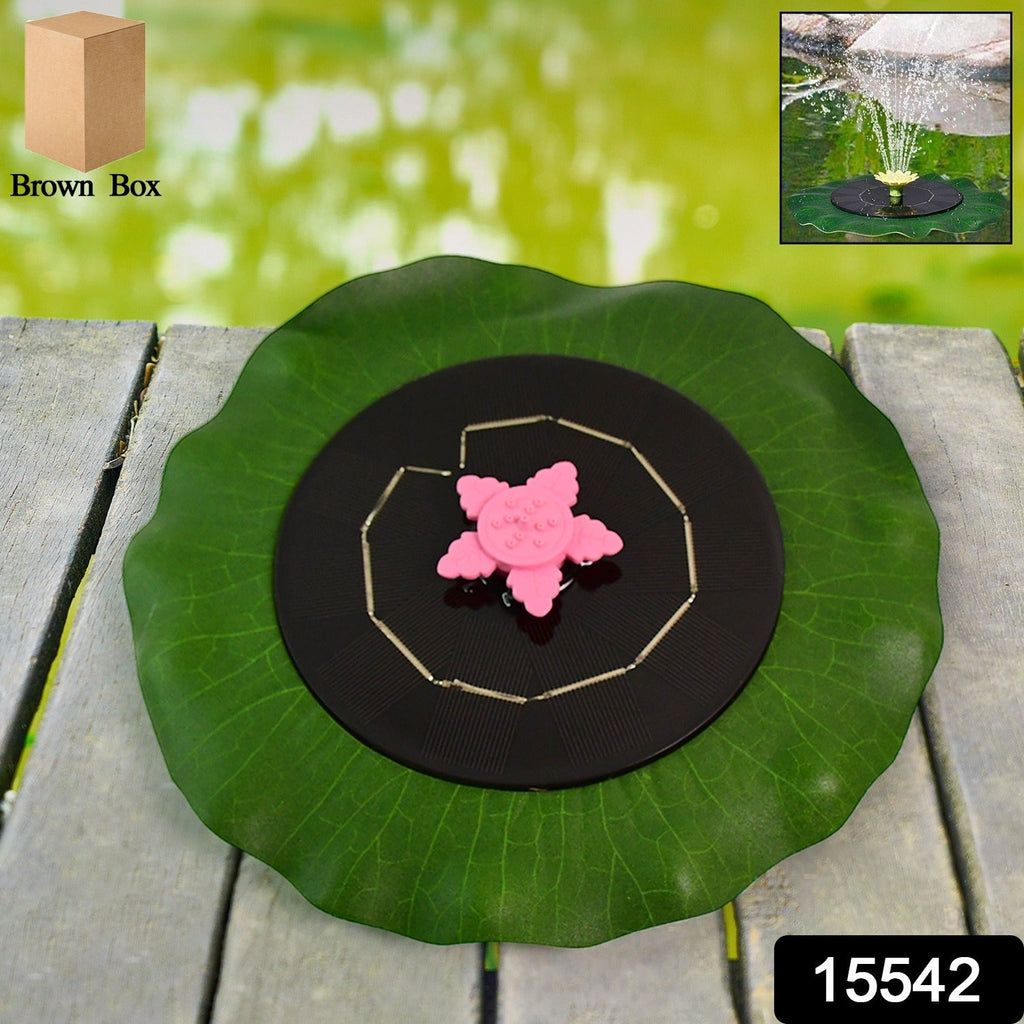 Decorative solar-powered water pump floating on pond with spray nozzle