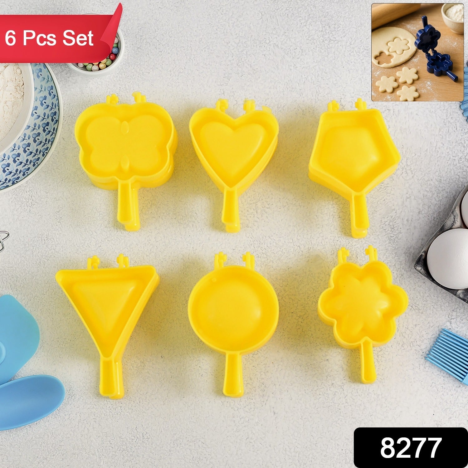 Close-up of plastic cookie cutters shaped like stars and flowers for baking