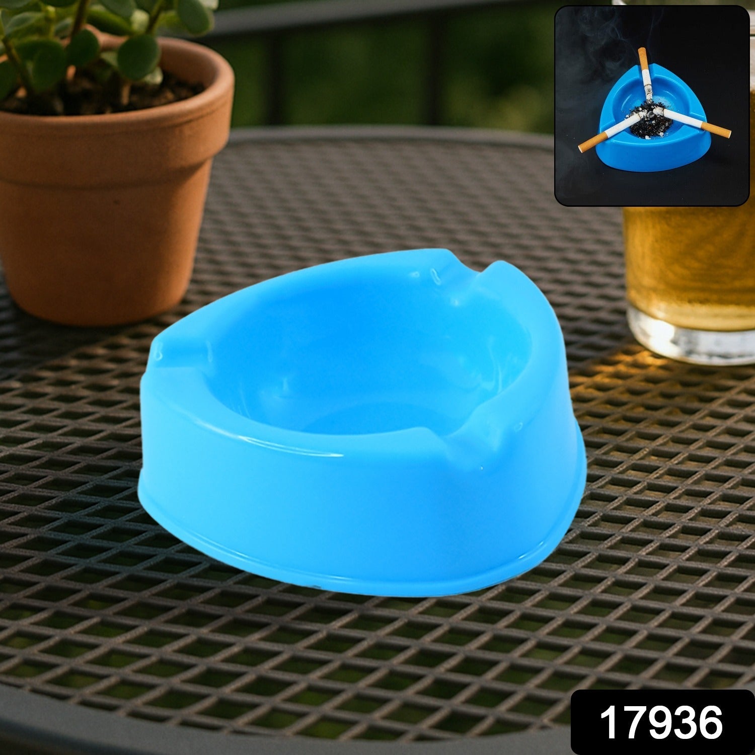 Plastic ashtray placed on outdoor patio table