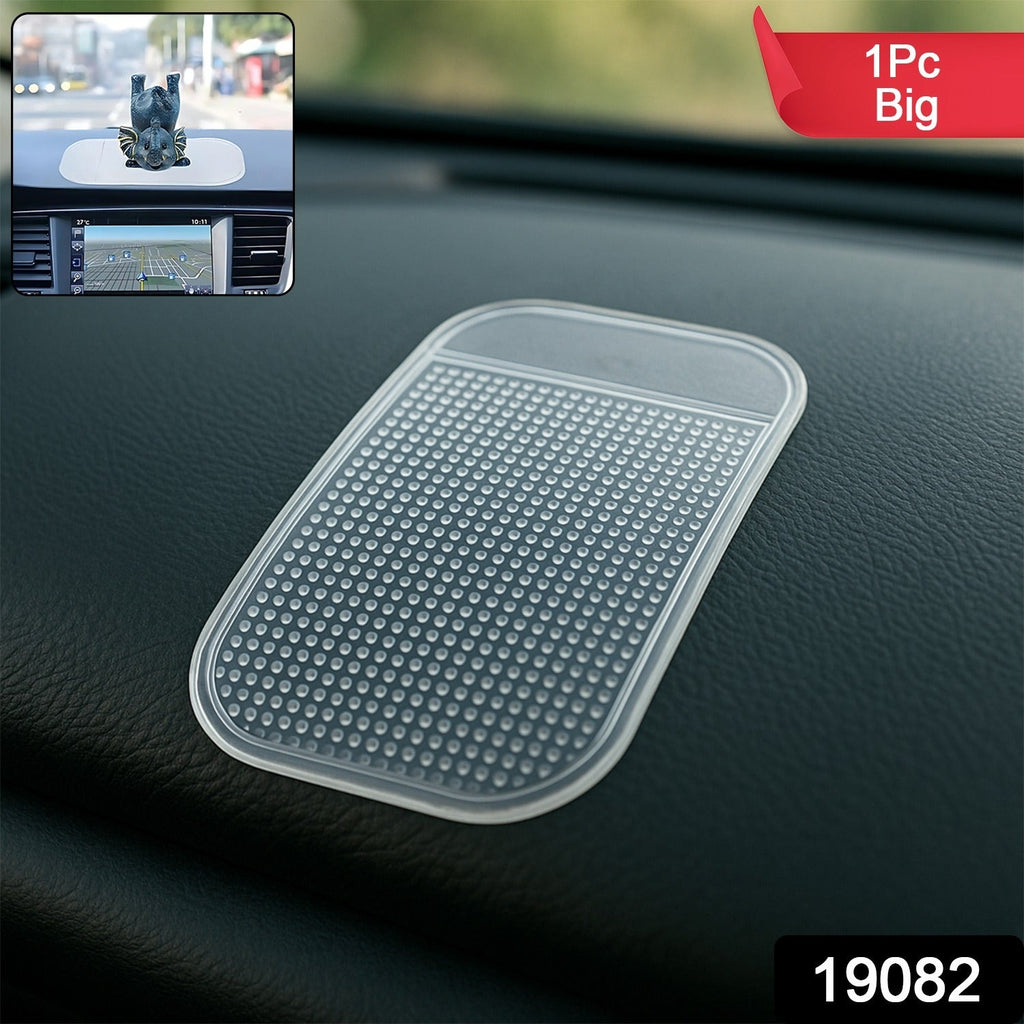Car dashboard showing anti-slip silicone mat holding phone and sunglasses