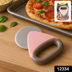 Close-up image of sharp rotating blade of pizza cutter