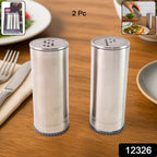 Classic stainless steel salt and pepper shakers arranged on dining table