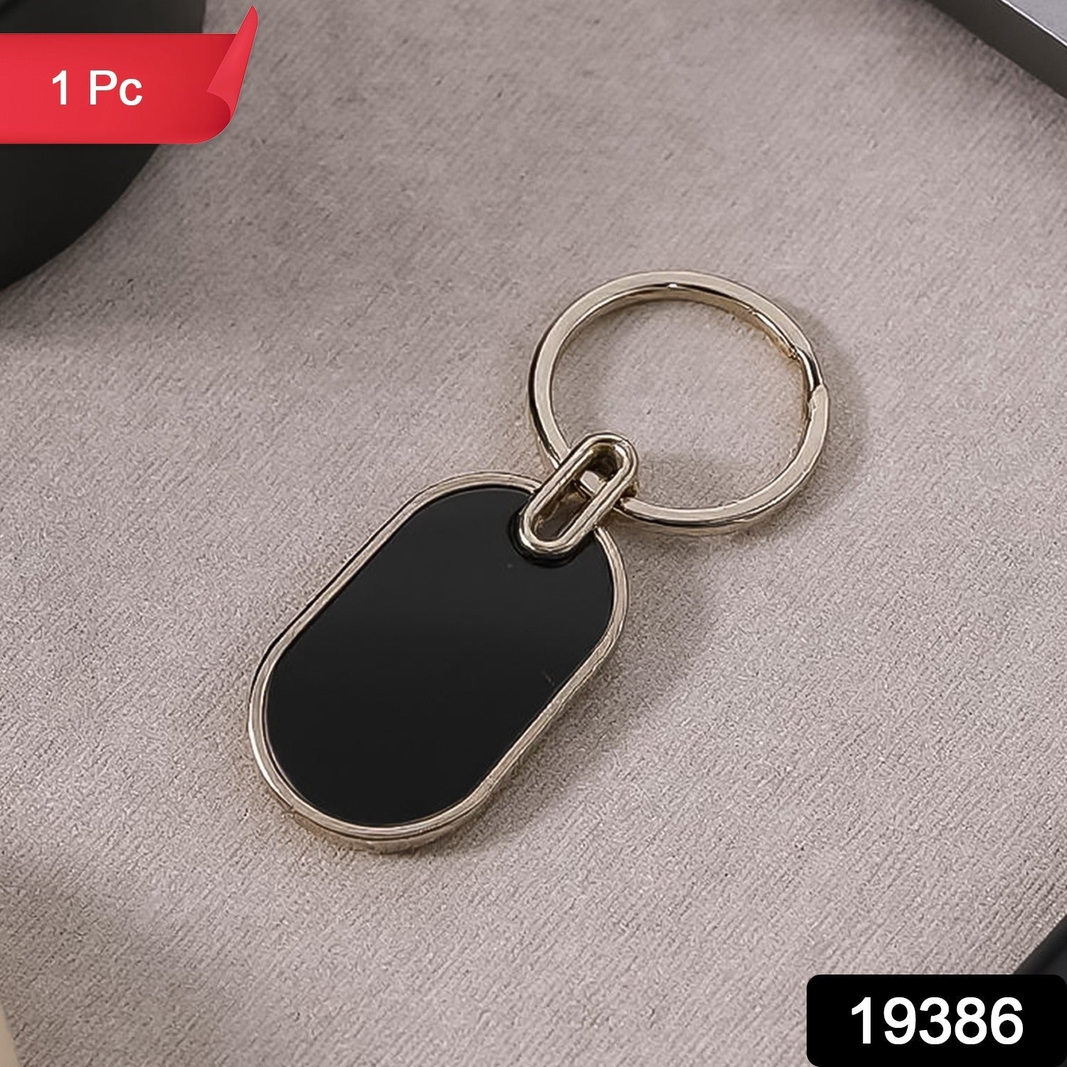 Sleek twin tone oval keychain in black and silver finish