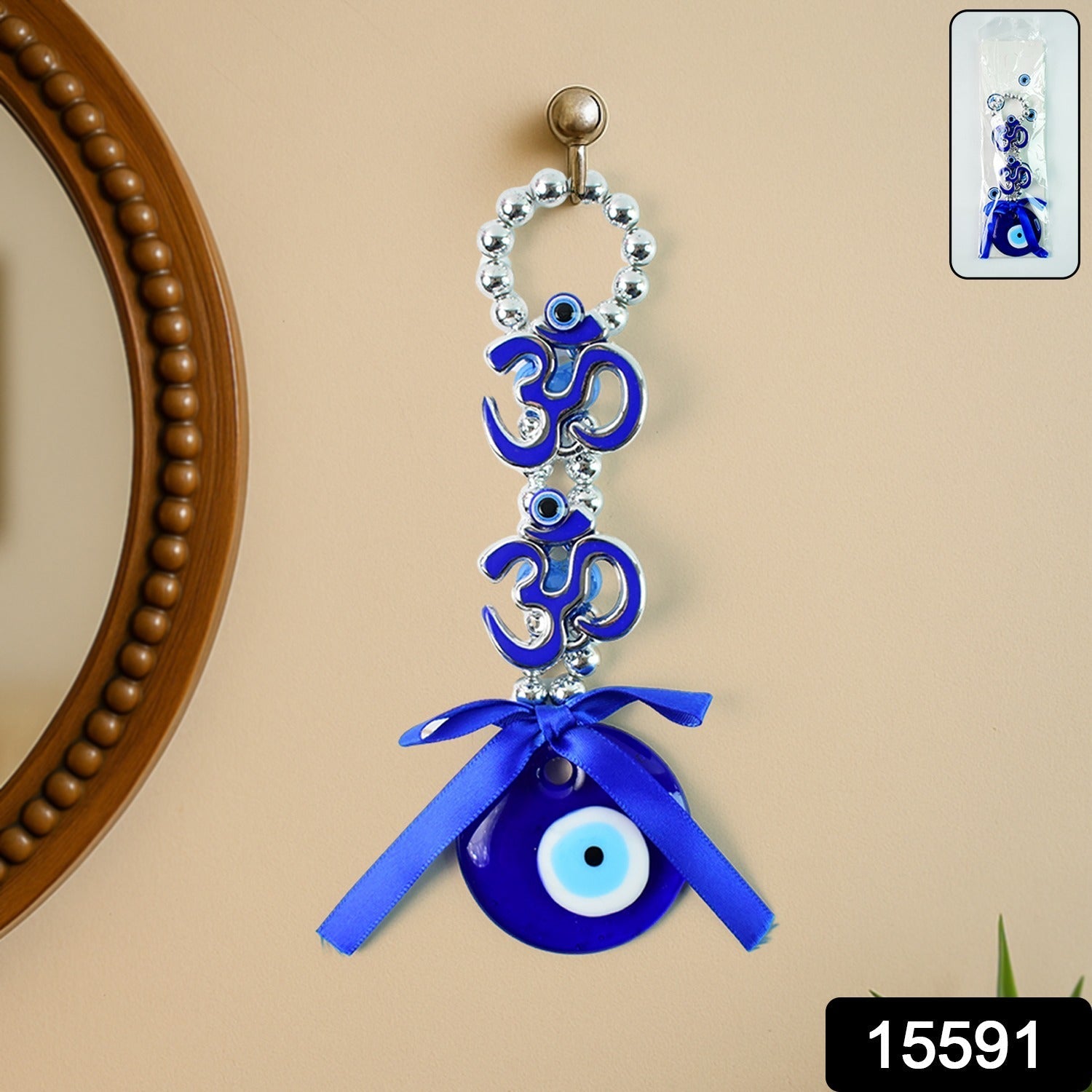 Wall hanging featuring decorative evil eye and twin OM symbols