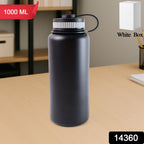 Portable insulated black water bottle holding cold beverage