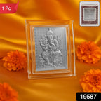 Close-up of intricate embossed silver Lord Ganesha design on photo frame
